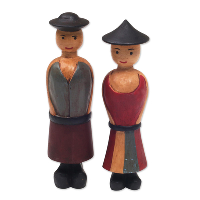 Holzfiguren, (Paar) - Zwei handgeschnitzte Holzfiguren eines Bauernpaares aus Bali