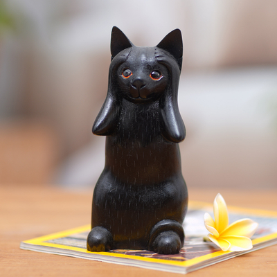 Wood sculpture, 'Kitty Hears No Evil' - Hand-Carved Black Suar Wood Cat Sculpture from Bali