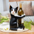 Wood wine bottle holder, 'Kitty Clasp' - Hand Carved Black and White Cat Figurine Wine Holder