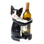 Wood wine bottle holder, 'Kitty Clasp' - Hand Carved Black and White Cat Figurine Wine Holder