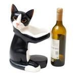 Wood wine bottle holder, 'Kitty Clasp' - Hand Carved Black and White Cat Figurine Wine Holder