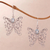 Blue topaz dangle earrings, 'Butterfly Swirls' - Blue Topaz and Sterling Silver Butterfly Earrings from Bali