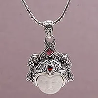 Garnet and rainbow moonstone pendant necklace, 'Diamond Warrior' - Garnet and Sterling Silver Face Pendant Necklace from Bali