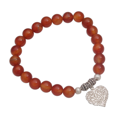 Carnelian beaded stretch bracelet, 'Loving Fantasy' - Red Carnelian Heart Charm Beaded Bracelet from Bali