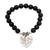 Onyx beaded stretch bracelet, 'Path of Love in Matte' - Black Onyx and Heart Charm Beaded Bracelet from Bali