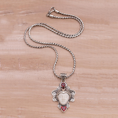 Garnet pendant necklace, 'Moonlight Warrior' - Garnet and Sterling Silver Pendant Necklace from Bali