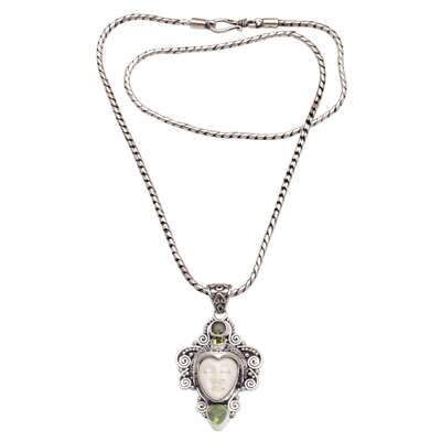 Peridot pendant necklace, 'Moonlight Warrior' - Peridot and Sterling Silver Face Necklace from Bali