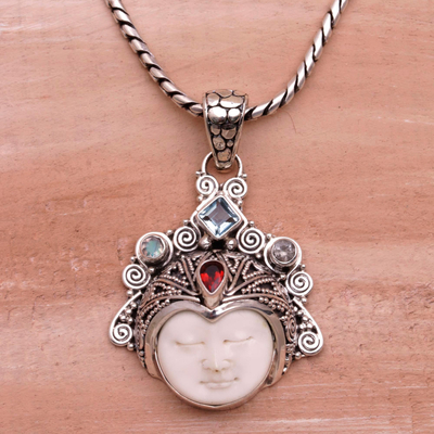Multi-gemstone pendant necklace, 'Diamond Warrior' - Blue Topaz and Garnet Face Pendant Necklace from Bali