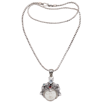 Multi-gemstone pendant necklace, 'Diamond Warrior' - Blue Topaz and Garnet Face Pendant Necklace from Bali