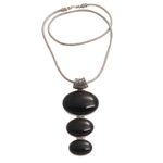 Onyx pendant necklace, 'Night Ovals' - Onyx and Sterling Silver Oval Pendant Necklace from Bali