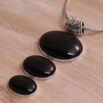 Onyx pendant necklace, 'Night Ovals' - Onyx and Sterling Silver Oval Pendant Necklace from Bali