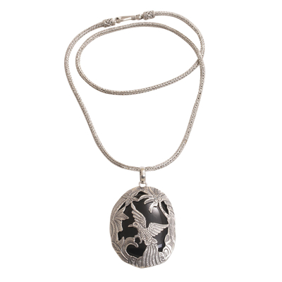 Onyx pendant necklace, 'Cendrawasih Haven' - Onyx and Sterling Silver Bird Pendant Necklace from Bali