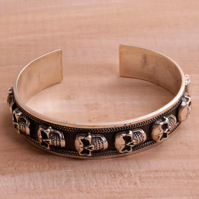 Men's sterling silver cuff bracelet, 'Fierce Skulls' - Men's Sterling Silver Skull Cuff Bracelet from Bali
