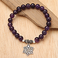 Amethyst beaded charm bracelet, 'Unity Flower' - Amethyst Religious Beaded Stretch Bracelet from Bali