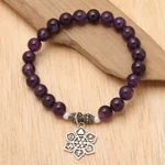 Amethyst beaded charm bracelet, 'Unity Flower' - Amethyst Religious Beaded Stretch Bracelet from Bali