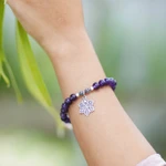 Amethyst beaded charm bracelet, 'Unity Flower' - Amethyst Religious Beaded Stretch Bracelet from Bali