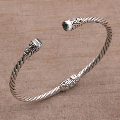 Blue topaz cuff bracelet, 'Spiral Temple' - Blue Topaz and Sterling Silver Cuff Bracelet from Bali