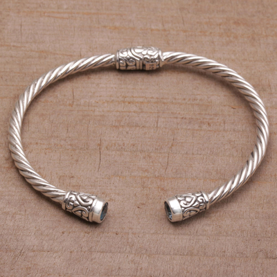 Blue topaz cuff bracelet, 'Spiral Temple' - Blue Topaz and Sterling Silver Cuff Bracelet from Bali