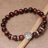 Tiger's eye beaded stretch bracelet, 'Temesir Om in Red' - Tiger's Eye Beaded Om Stretch Bracelet from Bali