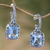Blue topaz half-hoop earrings, 'Buddha Curl Memories' - Blue Topaz and 925 Sterling Silver Half Hoop Earrings