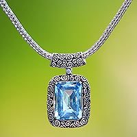 Blue topaz pendant necklace, 'Buddha Curl Memories'