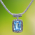 Blue topaz pendant necklace, 'Buddha Curl Memories' - Blue Topaz and Sterling Silver Pendant Necklace from Bali thumbail