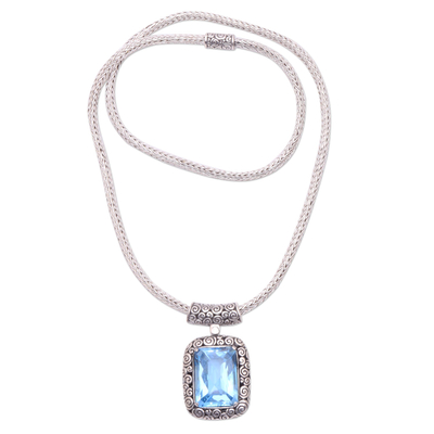 Blue topaz pendant necklace, 'Buddha Curl Memories' - Blue Topaz and Sterling Silver Pendant Necklace from Bali