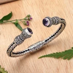 Amethyst cuff bracelet, 'Naga Temple' - Amethyst Naga Motif Sterling Silver Cuff Bracelet from Bali