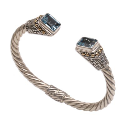 Gold accent blue topaz cuff bracelet, 'Glistening Baskets' - Gold Accent Faceted Blue Topaz Cuff Bracelet from Bali