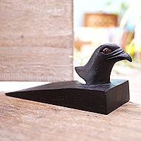 Wood doorstop, 'Helpful Eagle in Black' - Handcrafted Suar Wood Eagle Doorstop in Black from Bali