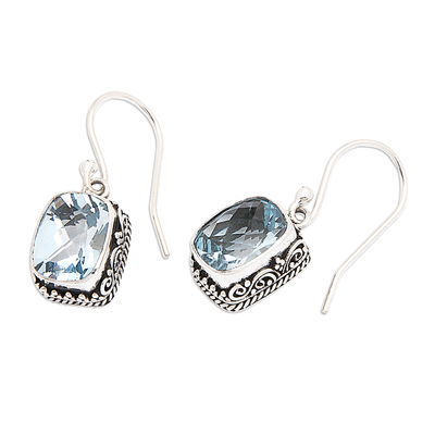 Blue topaz dangle earrings, 'Temple Gleam' - Blue Topaz and Sterling Silver Dangle Earrings from Bali