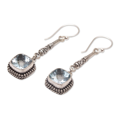 Blue topaz dangle earrings, 'Majestic Gleam' - Faceted Blue Topaz and 925 Silver Dangle Earrings from Bali