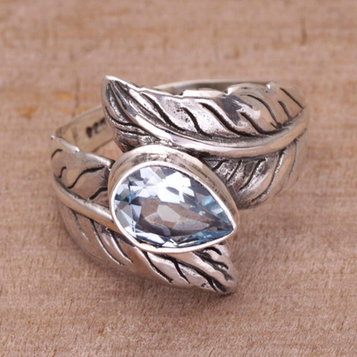 Blue topaz cocktail ring, 'Leafy Caress' - Blue Topaz and Sterling Silver Leaf Cocktail Ring from Bali