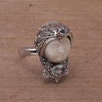 Blue topaz cocktail ring, 'Celuk Prince' - Blue Topaz and Carved Bone Sterling Silver Celuk Ring