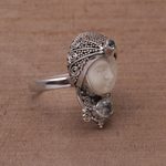 Blue topaz cocktail ring, 'Celuk Prince' - Blue Topaz and Carved Bone Sterling Silver Celuk Ring