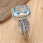 Blue topaz single stone ring, 'Razorleaf' - Blue Topaz Leaf-Themed Single Stone Ring from Bali