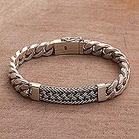 Men's sterling silver bracelet, 'Distinctive Style' - Sterling Silver Braided Wristband Bracelet from Bali