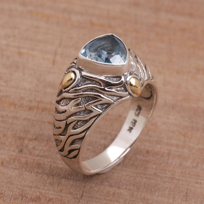 Blue topaz and gold accent single stone ring, 'Deep Roots' - Blue Topaz and Sterling Silver Ring with 18K Gold Accents