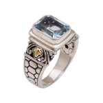 Gold accented blue topaz single stone ring, 'Blue Extravaganza' - Handmade Blue Topaz Single Stone Ring with Gold Accents