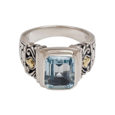 Gold accented blue topaz single stone ring, 'Blue Extravaganza' - Handmade Blue Topaz Single Stone Ring with Gold Accents
