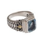 Gold accented blue topaz single stone ring, 'Blue Extravaganza' - Handmade Blue Topaz Single Stone Ring with Gold Accents