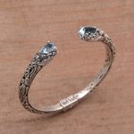 Blue topaz cuff bracelet, 'Transcendent Forest' - Floral Blue Topaz and Silver Cuff Bracelet from Bali