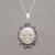 Peridot pendant necklace, 'Skull Stare in White' - Peridot and Bone White Skull Pendant Necklace from Bali thumbail