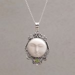 Peridot pendant necklace, 'Moonlight Stare' - Peridot and Bone Moon Pendant Necklace from Bali