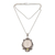 Peridot pendant necklace, 'Moonlight Stare' - Peridot and Bone Moon Pendant Necklace from Bali