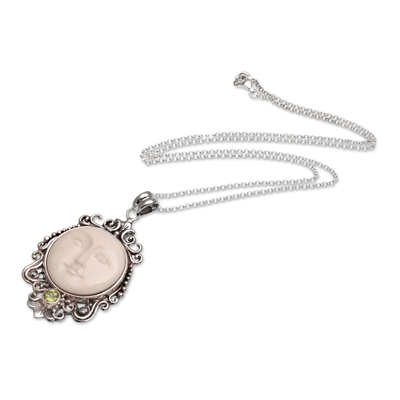 Peridot pendant necklace, 'Moonlight Stare' - Peridot and Bone Moon Pendant Necklace from Bali