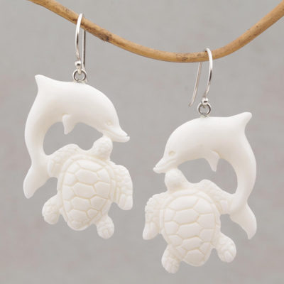 Bone dangle earrings, 'Friends Among the Waves' - Bone Dangle Earrings with Dolphin and Tortoise Theme