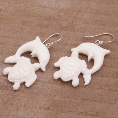 Bone dangle earrings, 'Friends Among the Waves' - Bone Dangle Earrings with Dolphin and Tortoise Theme