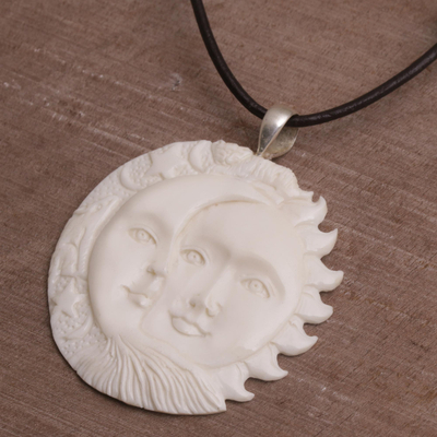 Bone pendant necklace, 'Stellar Guardians' - Handcrafted Sun and Moon Bone Pendant Necklace from Bali