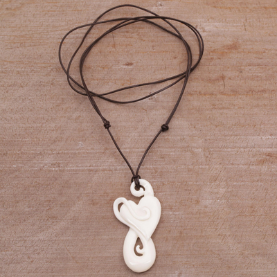 Bone pendant necklace, 'Untouched Heart' - Handcrafted Heart-Shaped Bone Pendant Necklace from Bali
